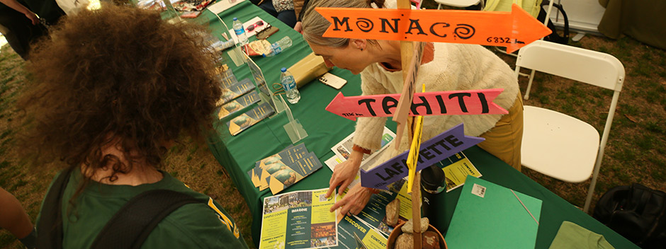 Visitors to campus get information at tables during the Day for Admitted Students activity fair