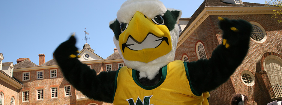 The griffin mascot poses in front of the Wren Building 